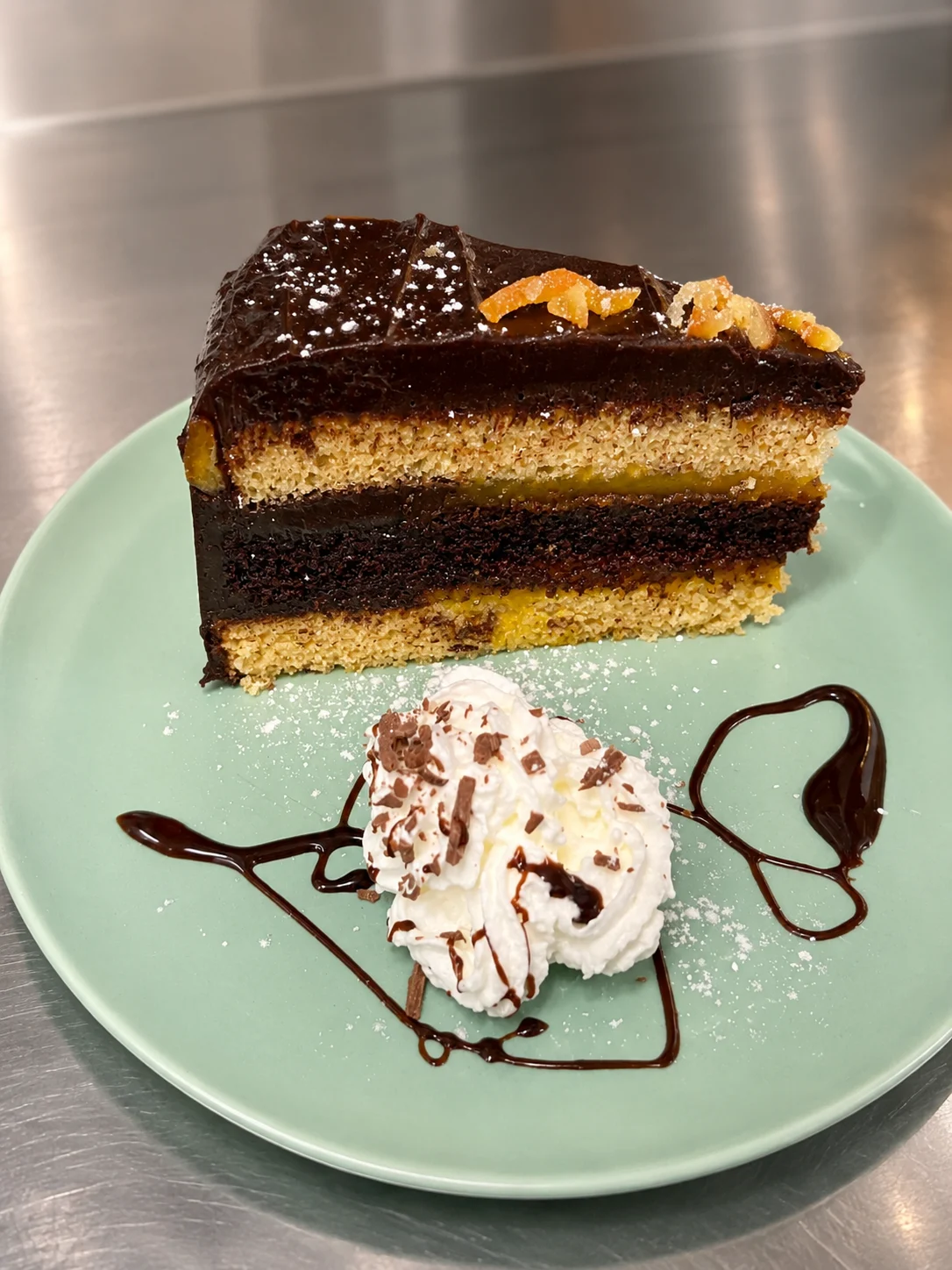 Layered chocolate cake served with cream