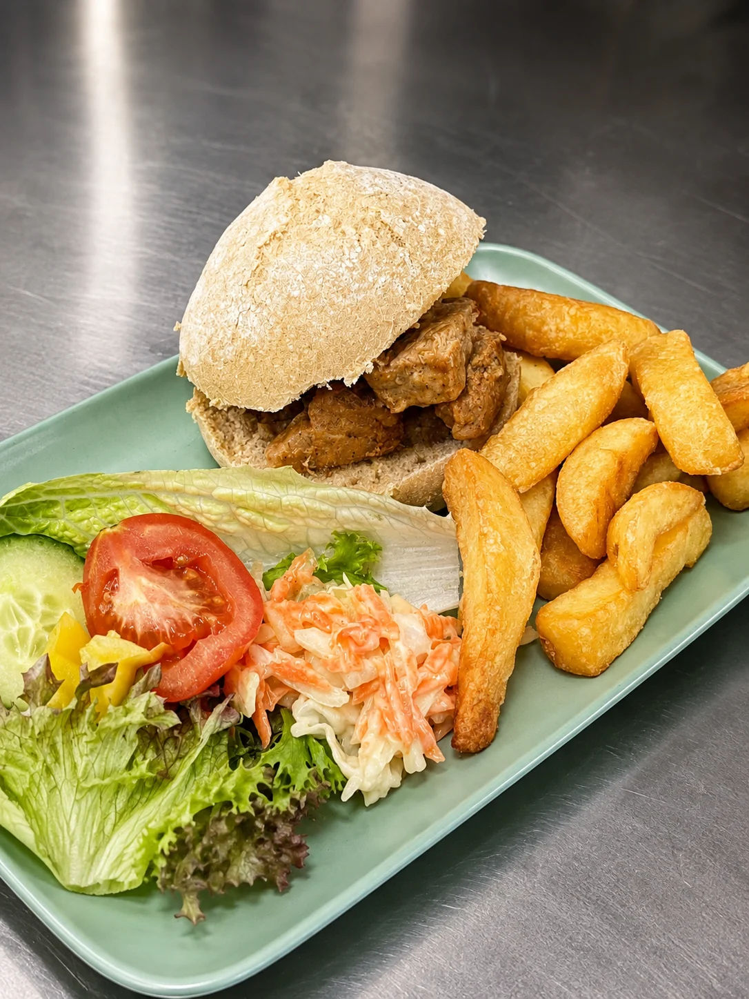 Filled roll served with chips, coleslaw and salad