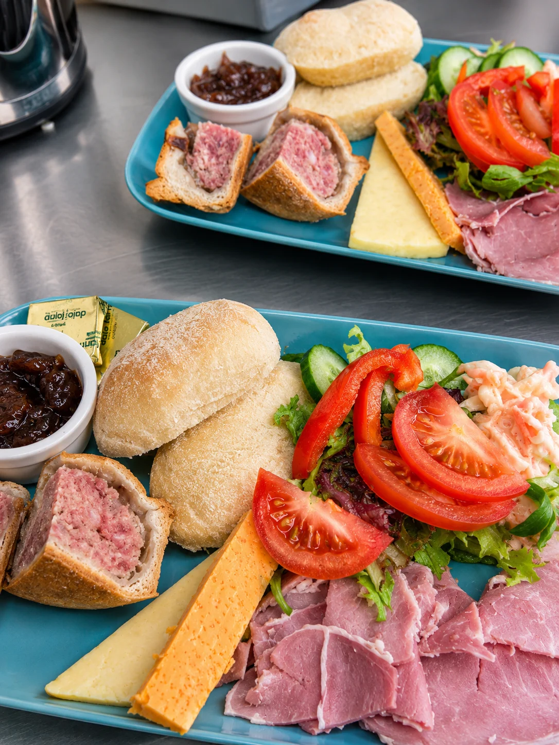 Lunch platters with bread, salad, cheese and cold meats