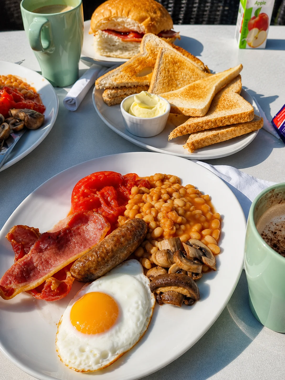 Cooked breakfast with toast and hot drinks